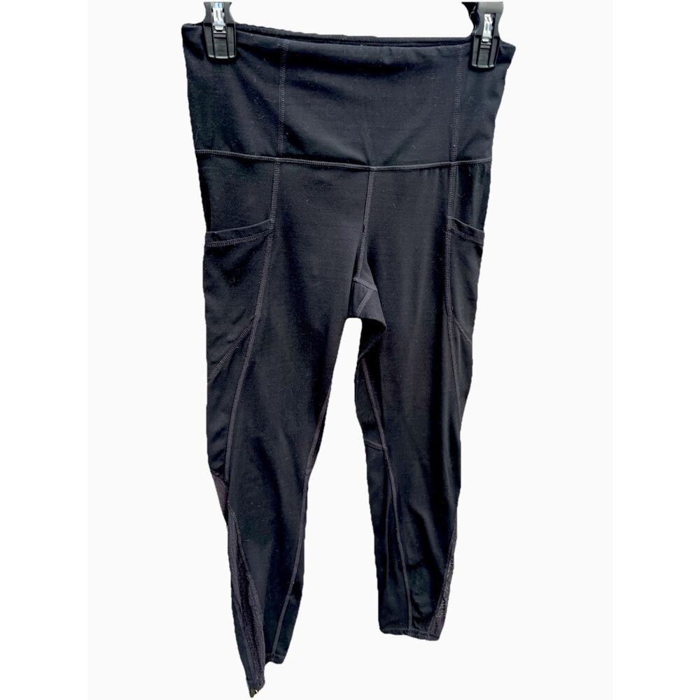 Athleta Salutation Stash Leggings Small Mesh Down Sides Pockets 7/8 Leggings EUC